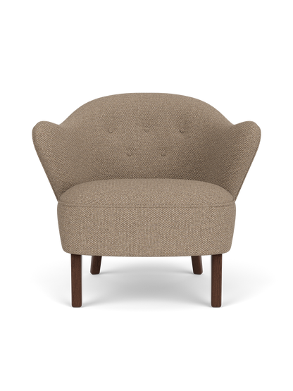 Ingeborg Lounge Chair in Logan Flint textile with dark stained oak legs, featuring a sculptural, curved silhouette.