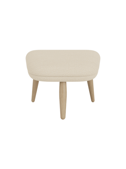 Front view of the Oda Ottoman, upholstered in a light cream Hallingdal 200 fabric, with four angled legs in natural oak.