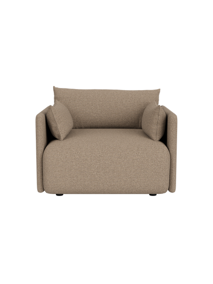 Front view of the Offset Sofa, a 1-seater armchair upholstered in textured Logan Flint fabric against a black background.