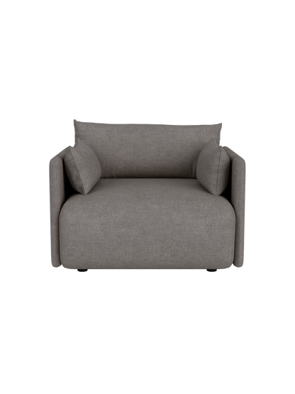 A high-angle, front-on view of the Offset Sofa as a 1-seater armchair, upholstered in a textured grey Audo Bouclé fabric.