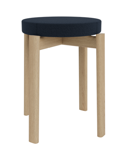 The Passage Stool, Upholstered, shown in natural oak with a dark blue Vidar 0786 fabric seat against a plain background.