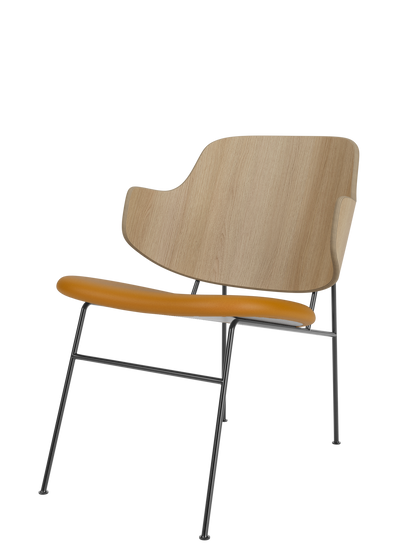 The Penguin Lounge Chair with a curved natural oak back, a tan leather seat, and a slim, dark powder-coated steel frame.