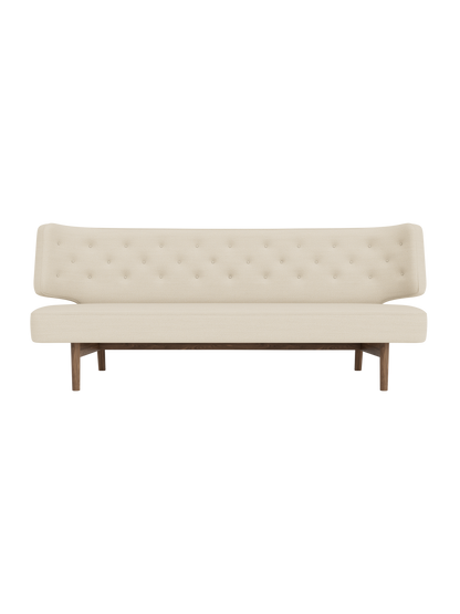 Front view of the Radiohus Sofa P2 in light cream upholstery with a button-tufted back and a dark walnut wood frame.