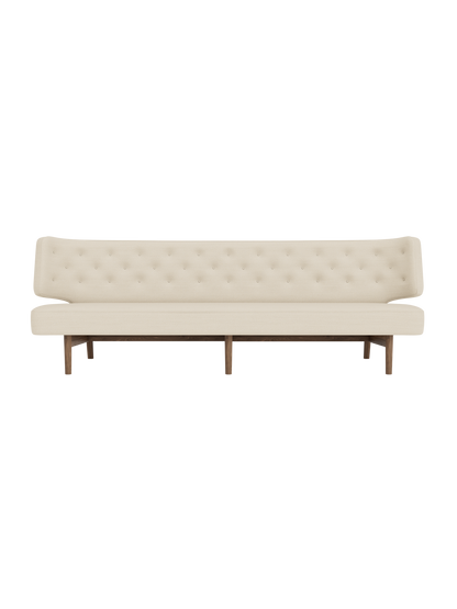 Front view of the Radiohus Sofa P3 in a cream button-tufted upholstery, with a dark walnut frame, on a black background.