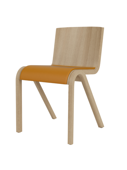 Front three-quarter view of the Ready Dining Chair. It has a natural oak frame and a tan upholstered seat.