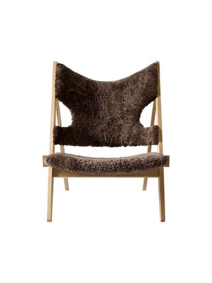 A front photo of the Knitting Lounge Chair. It features a Natural Oak frame and plush, dark brown Root Sheepskin upholstery.