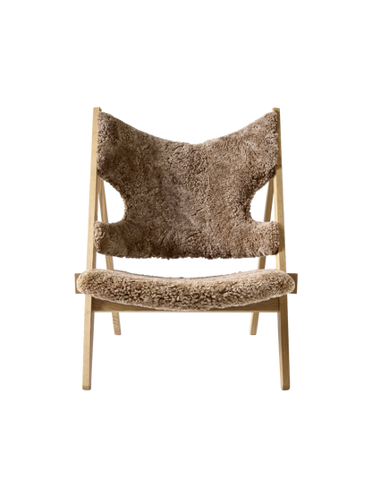 Front view of the Knitting Lounge Chair with a natural oak frame, upholstered in textured, light brown Sahara sheepskin.