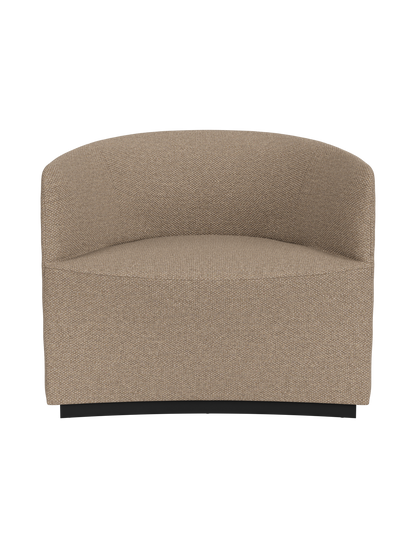 The Tearoom Lounge Chair, upholstered in light brown, textured Logan Flint fabric against a black background.