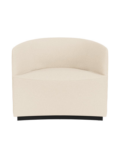 Front view of the Tearoom Lounge Chair upholstered in Logan Jasmine, a textured cream fabric, on a recessed dark base.