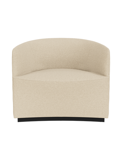 A front-on shot of the sculptural Tearoom Lounge Chair, fully upholstered in a textured, sand-coloured Logan Sand fabric.