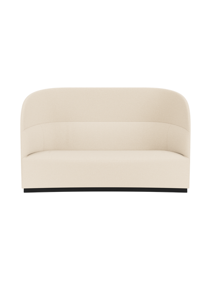 Front view of the Tearoom Sofa, High Back in light Logan Jasmine fabric. It features a high, enveloping back and black base.