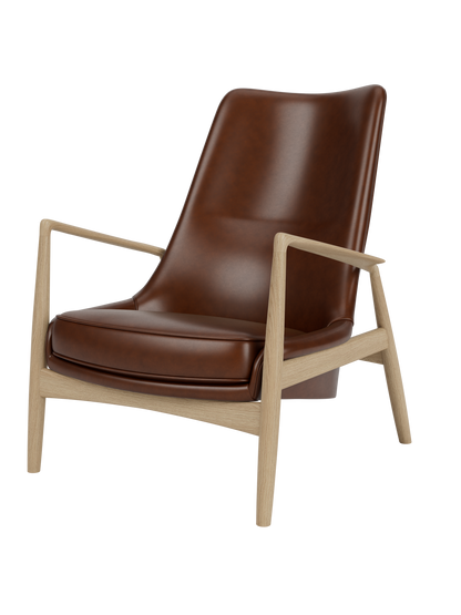 Studio shot of The Seal Lounge Chair, High Back. The chair has a natural oak frame and is upholstered in dark brown leather.