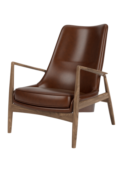 The Seal Lounge Chair, High Back, featuring a sculptural walnut frame and a floating high-backed seat in rich brown leather.