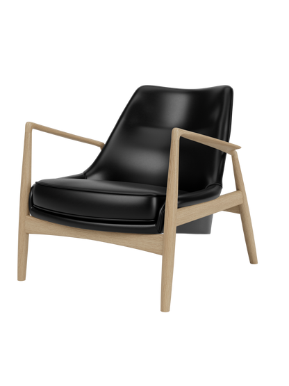 The Seal Lounge Chair, Low Back, shown at a three-quarter angle, featuring a natural oak frame and black leather upholstery.