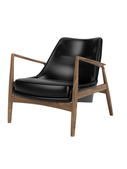 A three-quarter view of The Seal Lounge Chair, Low Back, with black leather seat and backrest and a walnut frame.