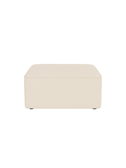 The Eave Modular Sofa Pouf, 86cm, shown from the front. It is upholstered in a textured, off-white Logan Jasmine fabric.