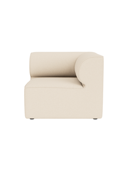 The Eave Modular Sofa's corner section in light-coloured Logan Jasmine fabric, viewed from above against a black background.