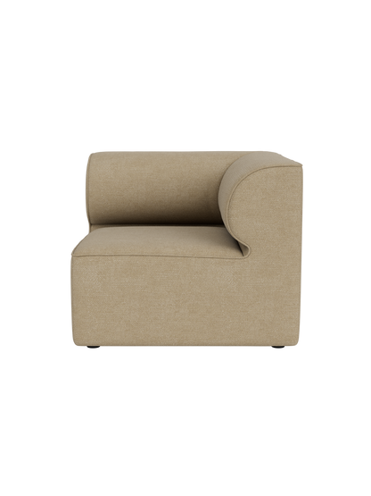 Side view of the Eave Modular Sofa, 86, Corner section in light beige Audo Bouclé 02 fabric against a black background.