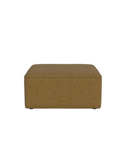 A square Eave Modular Sofa 86 Pouf in a textured, mustard yellow Audo Bouclé 06 fabric, seen front-on on a black background.