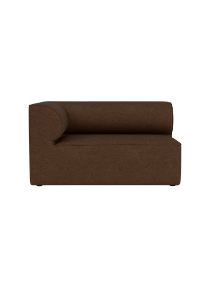 Front view of the Eave Modular Sofa, 86, Corner 129 piece in brown Audo Bouclé 07 fabric against a black background.
