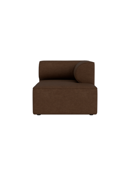 Front view of Eave Modular Sofa Chaise Longue module upholstered in brown Audo Bouclé 07 fabric against a black background.