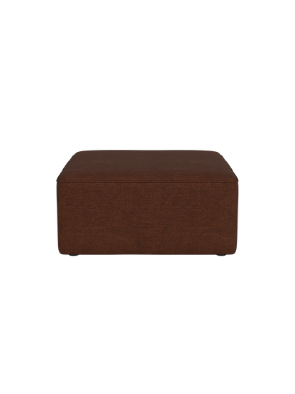 Side view of the Eave Modular Sofa Pouf, 86, upholstered in textured, brown Audo Bouclé 08 fabric against a black background.