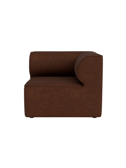 A front view of the Eave Modular Sofa, 86, Corner in a reddish-brown Audo Bouclé 08 fabric, isolated on a black background.