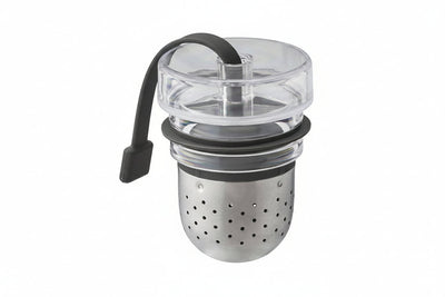 The Audo Copenhagen Tea Egg, with a perforated stainless steel basket, a clear plastic lid and a black silicone tab.