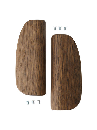 Pair of dark walnut curved wooden armrests with visible grain and four small metal screws on white background