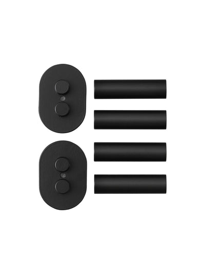 A set of black metal distance holders for the Audo Umanoff Side Table laid out flat against a white background.