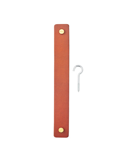 Umanoff Hanger components: a tan leather strap with brass screw details and a silver metal ceiling hook on a white background