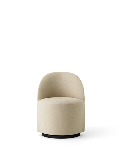 A front-on view of the Tearoom Club Chair, Swivel w/ Return, upholstered in a light beige Hallingdal fabric on a black base.