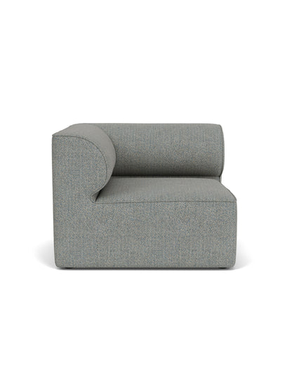 A front view of the Eave Modular Sofa, 96, Corner Left module, upholstered in a textured, mottled grey Safire 012 fabric.