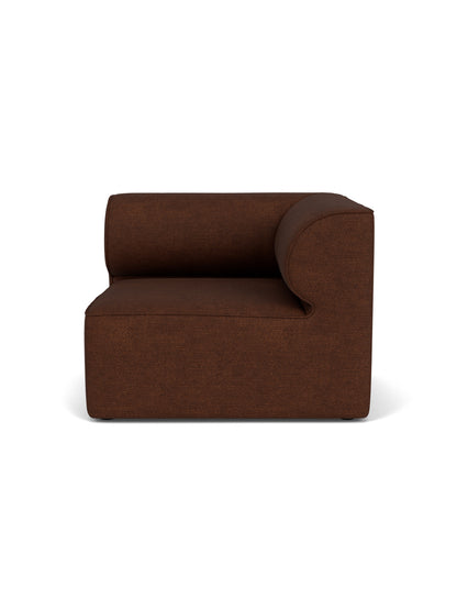 Front view of the Eave Modular Sofa, 96, Corner Right piece, upholstered in a textured, dark brown Audo Bouclé 08 fabric.