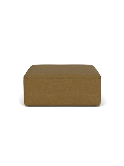 Front view of the Eave Modular Sofa, 96, Pouf, a square footstool upholstered in a brownish-gold Audo Bouclé 06 fabric.